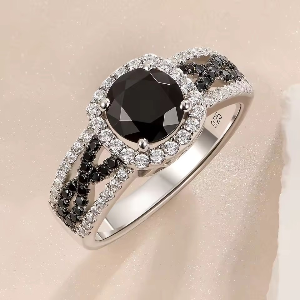 Dara Black Halo Statement Ring crafted in 925 sterling silver with white gold plating featuring a premium 5A black cubic zirconia centre stone and split pavé halo design.